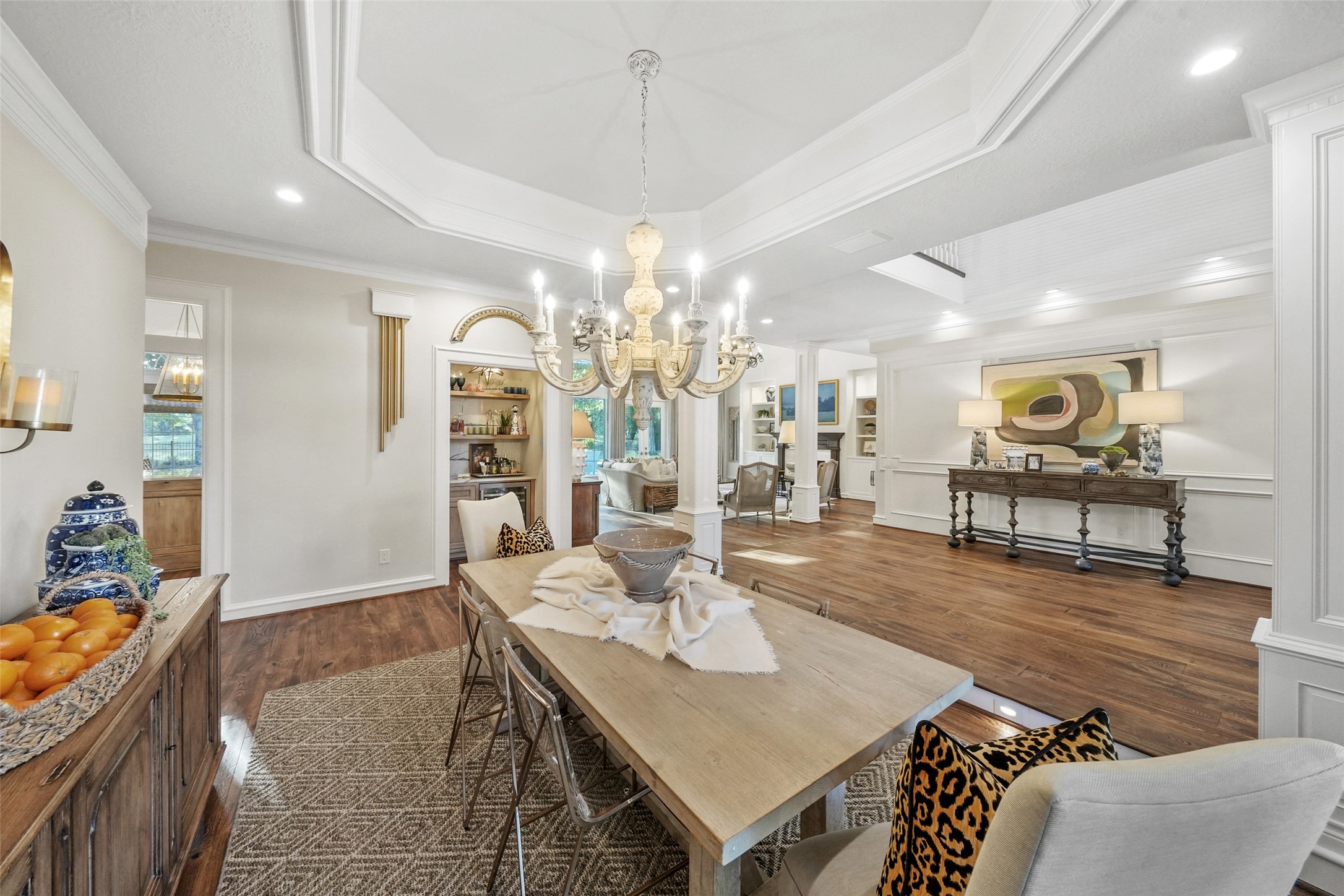 2207 Longmire Road Conroe, TX 77304 - Photo 11 of 46 a view of a dining room with furniture and wooden floor