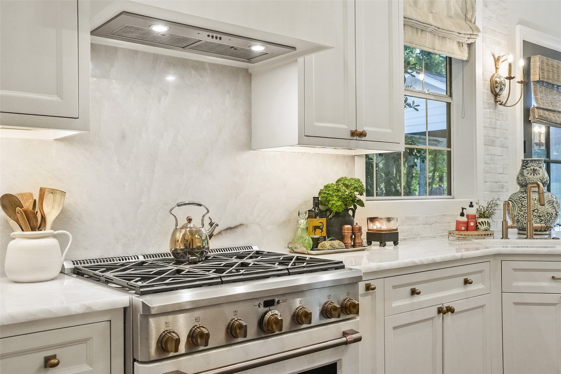 2207 Longmire Road Conroe, TX 77304 - Photo 16 of 46 a stove top oven sitting inside of a kitchen