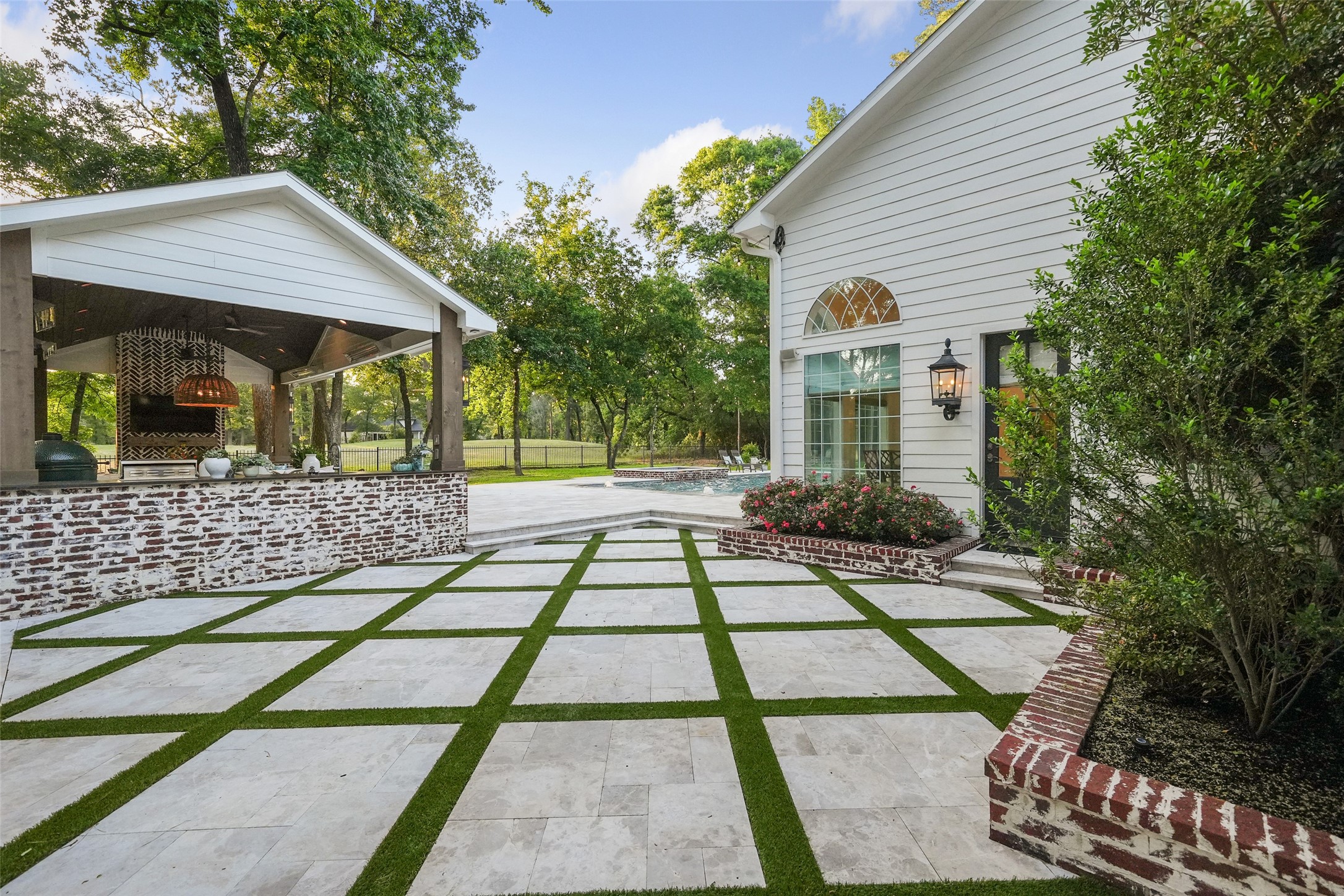 2207 Longmire Road Conroe, TX 77304 - Photo 2 of 46 a front view of a house with garden