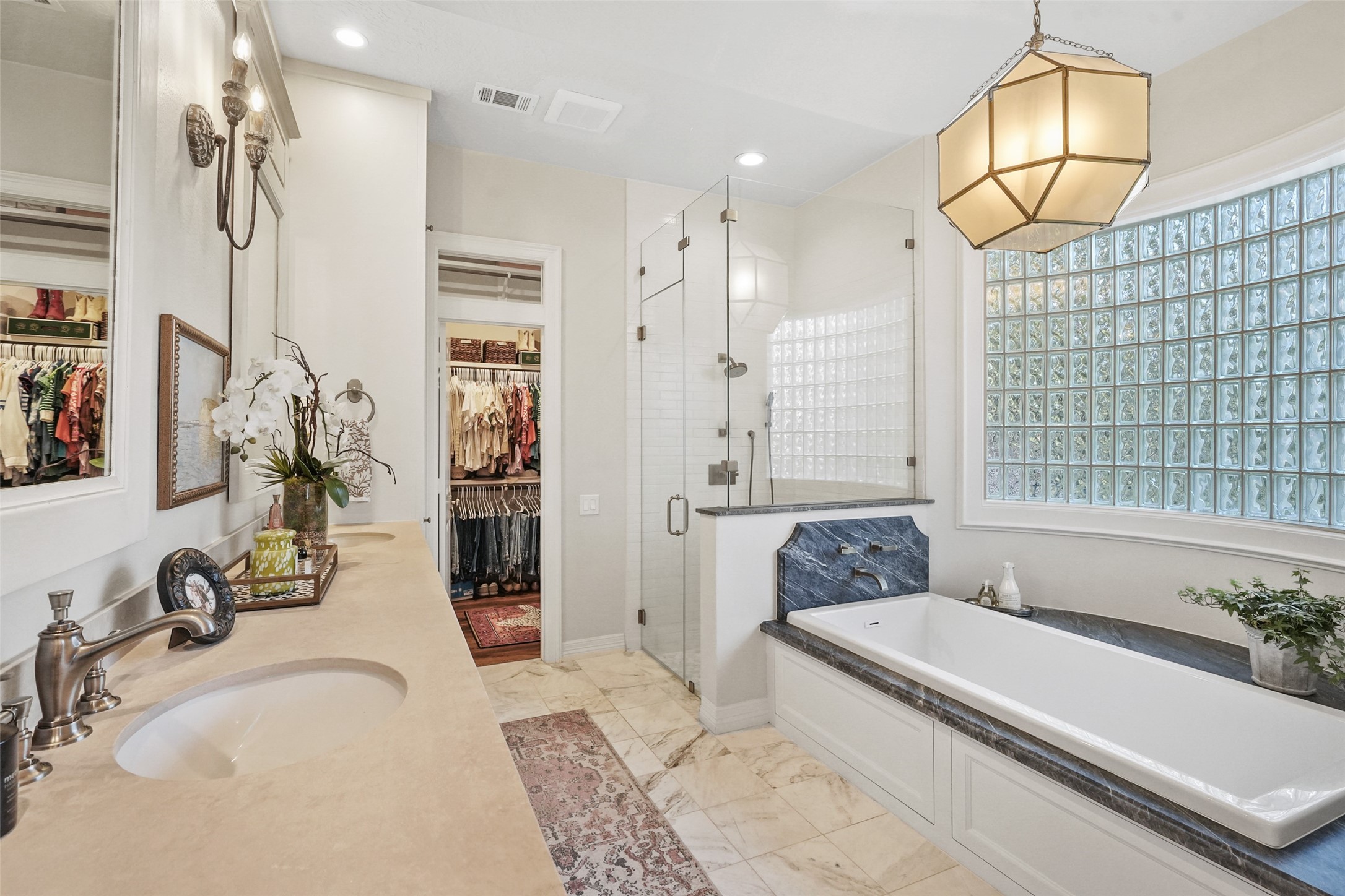 2207 Longmire Road Conroe, TX 77304 - Photo 21 of 46 a bathroom with a tub sink and mirror