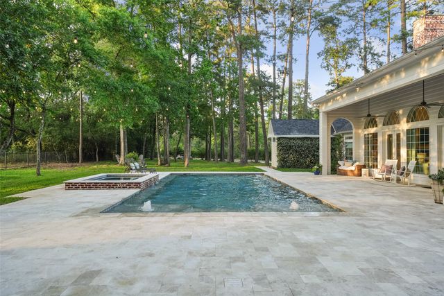 a view of backyard of house with green space