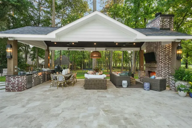 an outdoor space with patio furniture and garden view