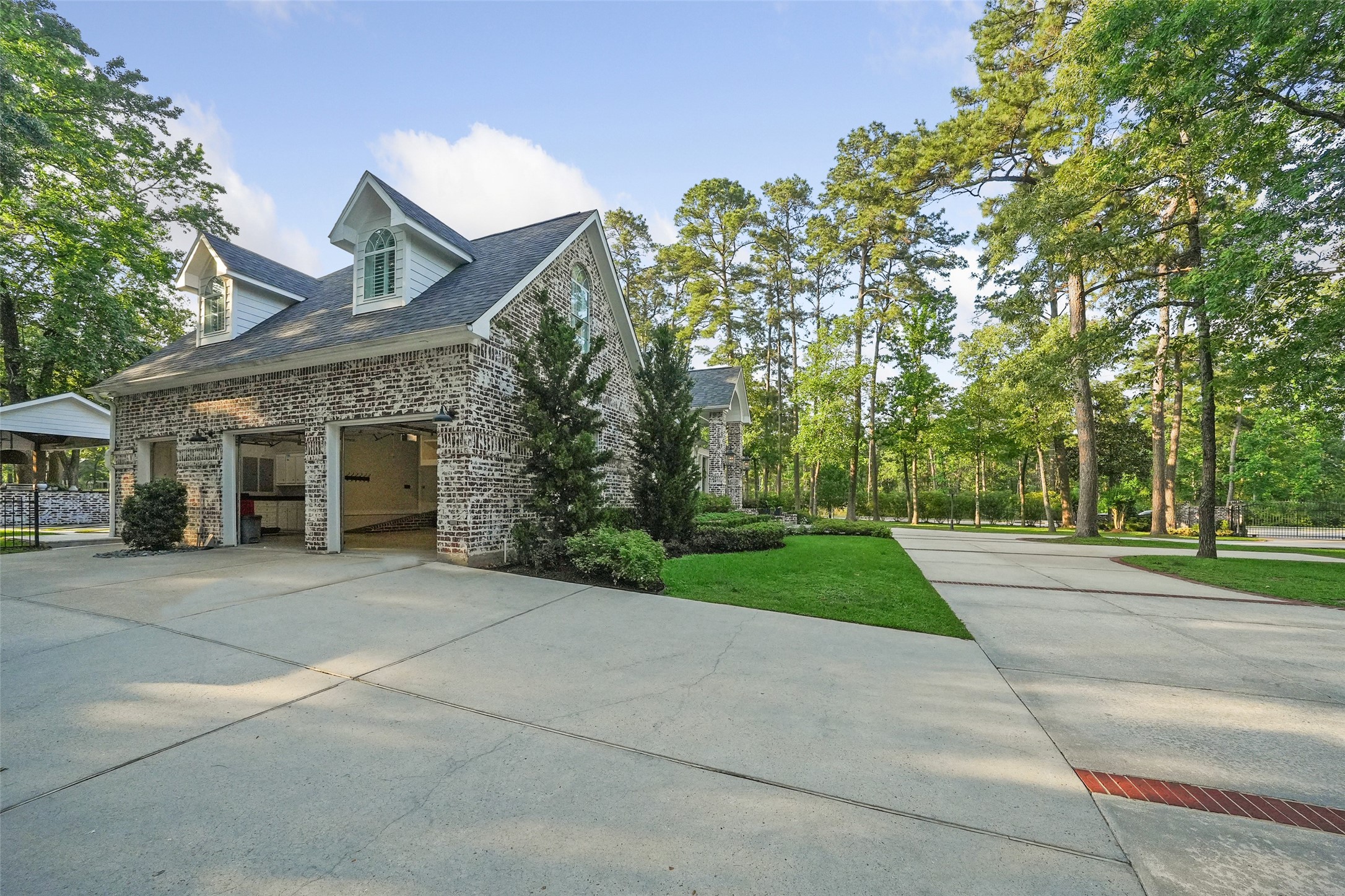 2207 Longmire Road Conroe, TX 77304 - Photo 44 of 46 front view of a building with a yard