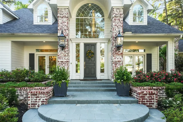 front view of a house with a garden