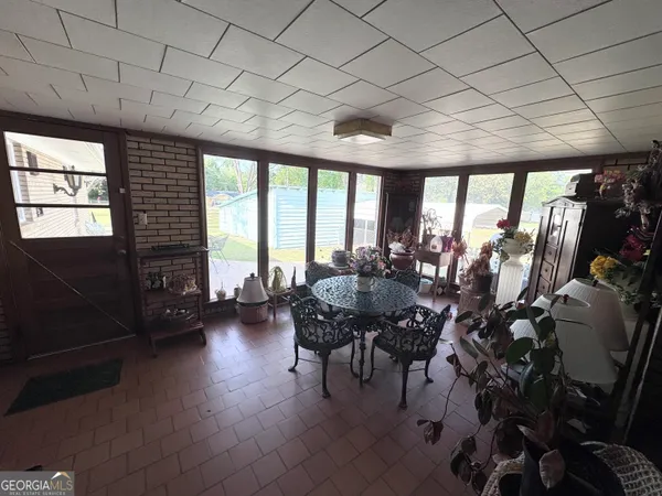 a view of a livingroom with furniture and window