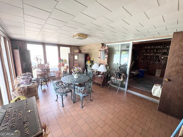 a view of a dining room with furniture window and outside view