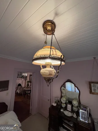 a room with a couch and chandelier