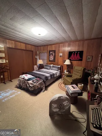a bedroom with furniture and a projector