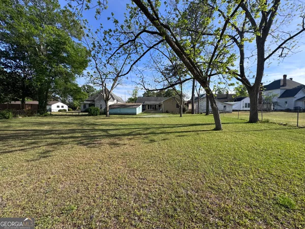 a big yard with trees