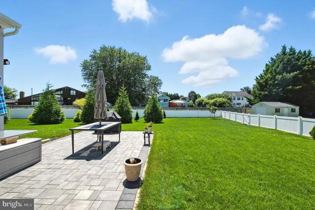 a view of a garden with lawn chairs