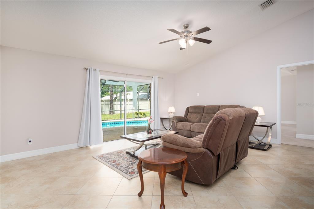 29 Rybark Lane Palm Coast, FL 32164 - Photo 12 of 41 a living room with furniture and a window