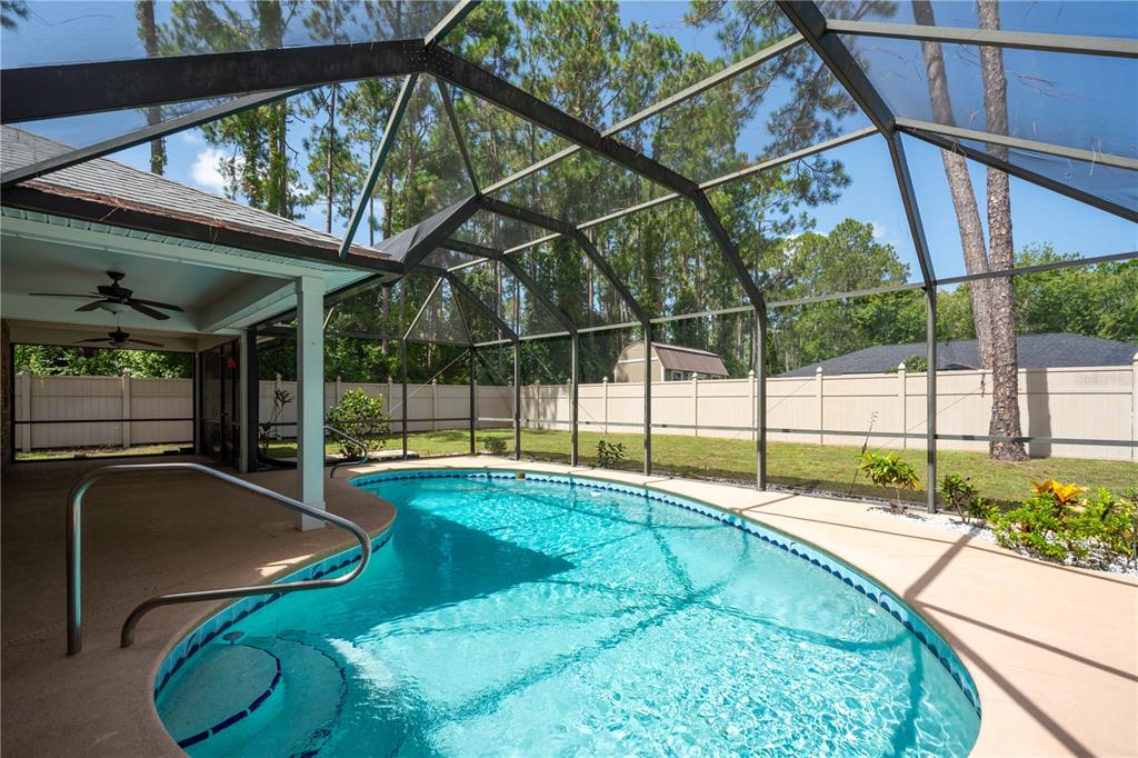 29 Rybark Lane Palm Coast, FL 32164 - Photo 14 of 41 a view of swimming pool with a backyard