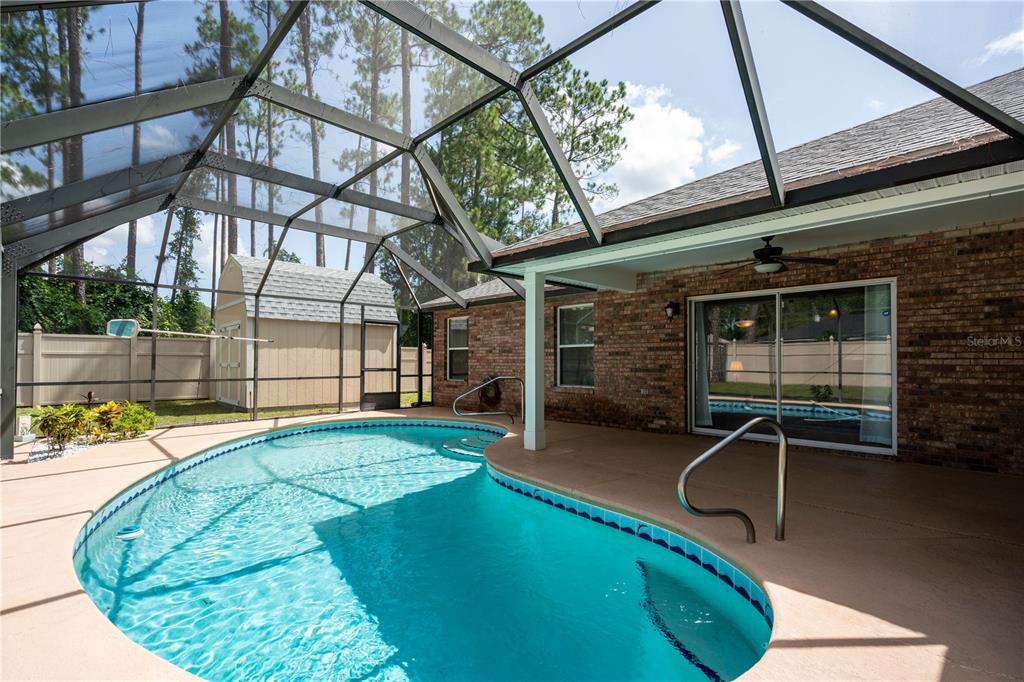 29 Rybark Lane Palm Coast, FL 32164 - Photo 2 of 41 a view of a swimming pool with a patio