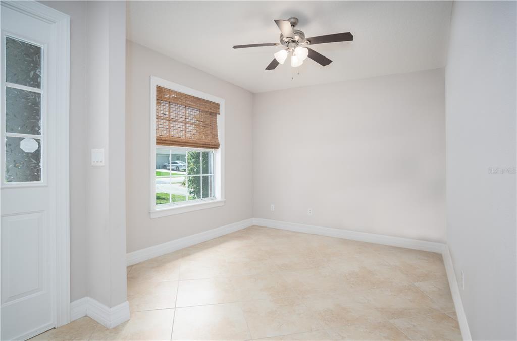 29 Rybark Lane Palm Coast, FL 32164 - Photo 22 of 41 an empty room with a window and a fan