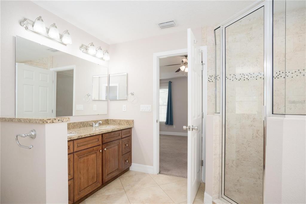 29 Rybark Lane Palm Coast, FL 32164 - Photo 23 of 41 a spacious bathroom with a granite countertop sink mirror and double