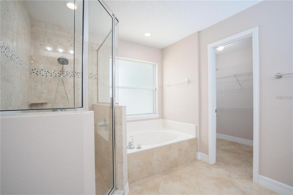29 Rybark Lane Palm Coast, FL 32164 - Photo 24 of 41 a bathroom with a bathtub and a shower