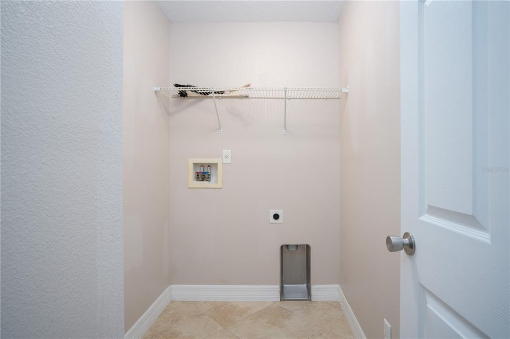 29 Rybark Lane Palm Coast, FL 32164 - Photo 30 of 41 a view of small space with racks on the wall