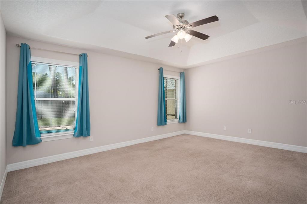 29 Rybark Lane Palm Coast, FL 32164 - Photo 38 of 41 an empty room with windows and fan