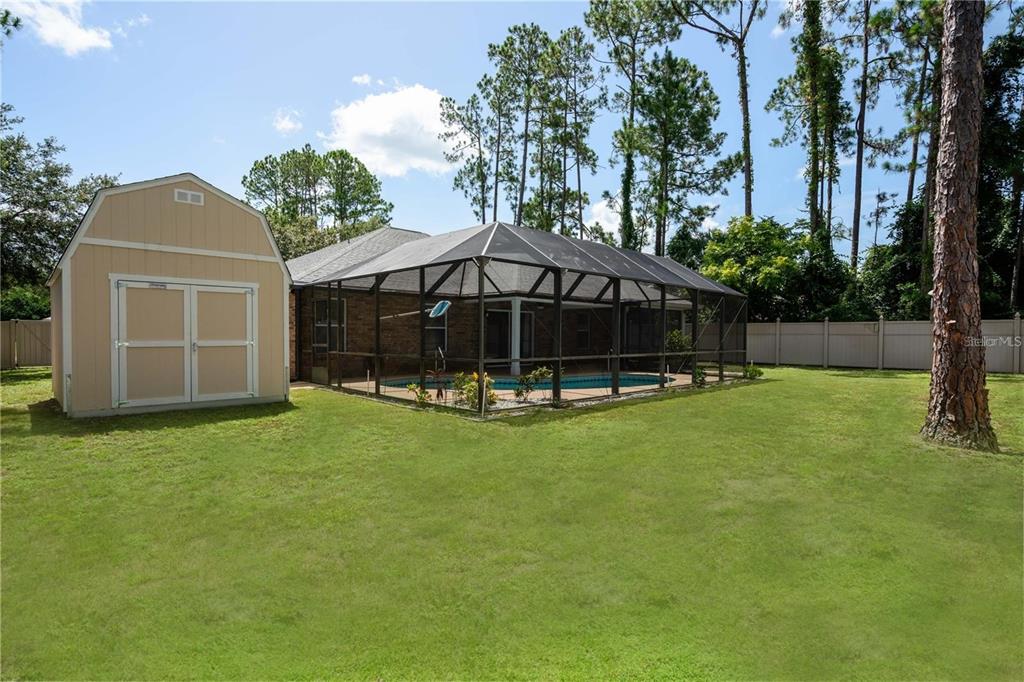 29 Rybark Lane Palm Coast, FL 32164 - Photo 40 of 41 a view of a house with backyard and garden