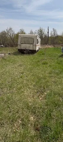 a view of a lake with houses in the background