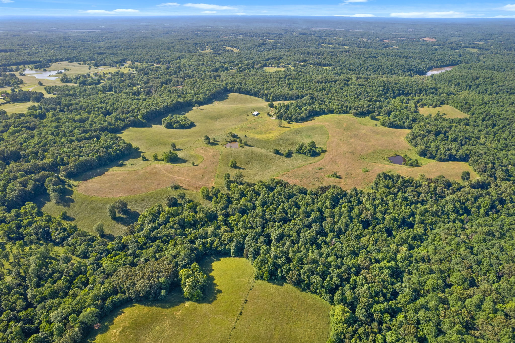 0 Happy Hills Acre Road Woodlawn, TN 37191 - Photo 19 of 32 a view of a backyard of a house with a mountain