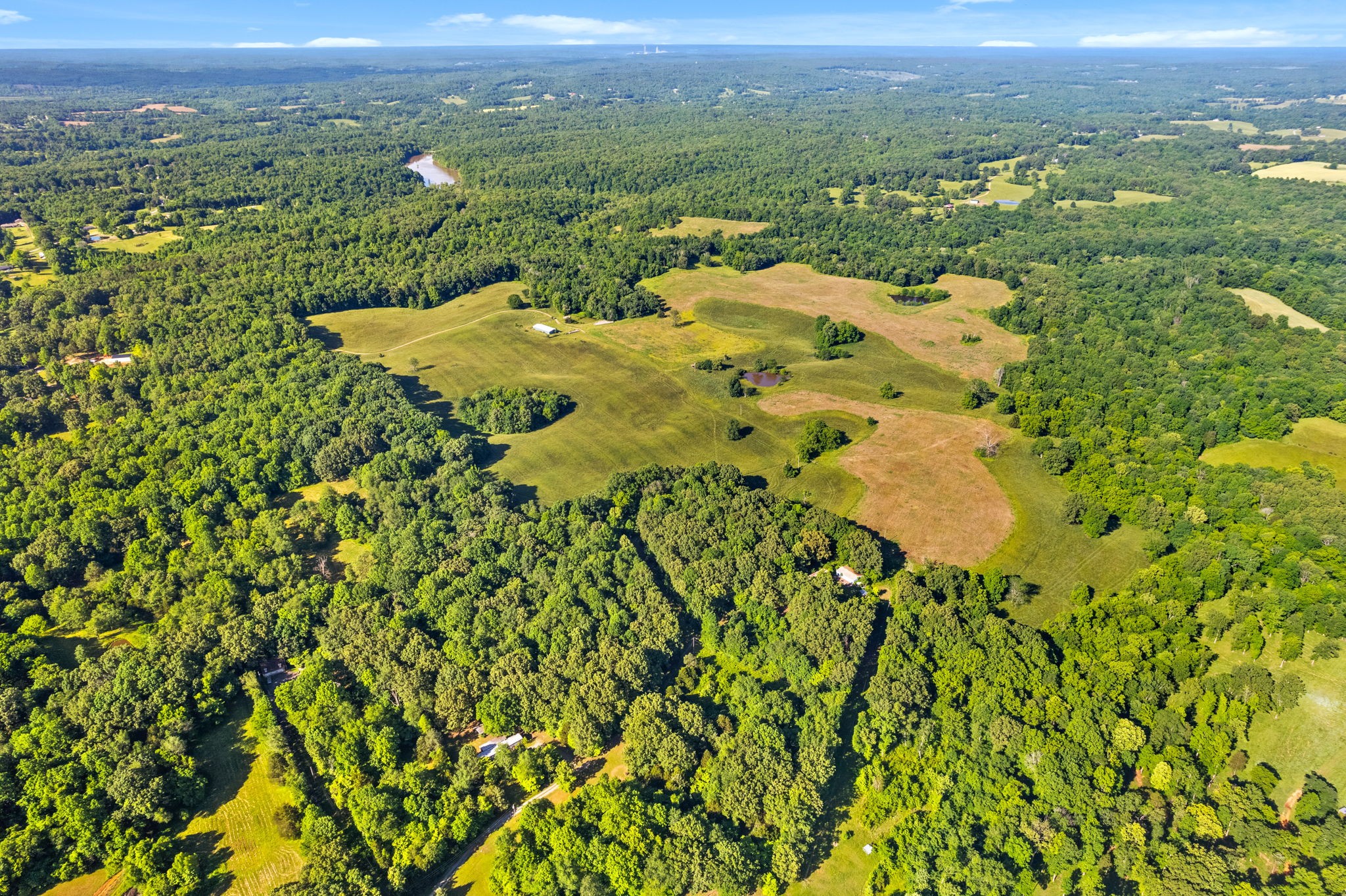 0 Happy Hills Acre Road Woodlawn, TN 37191 - Photo 25 of 32 a view of a city with lush green forest