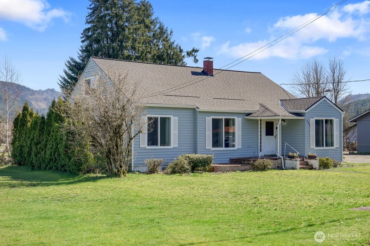 a front view of house with yard and green space