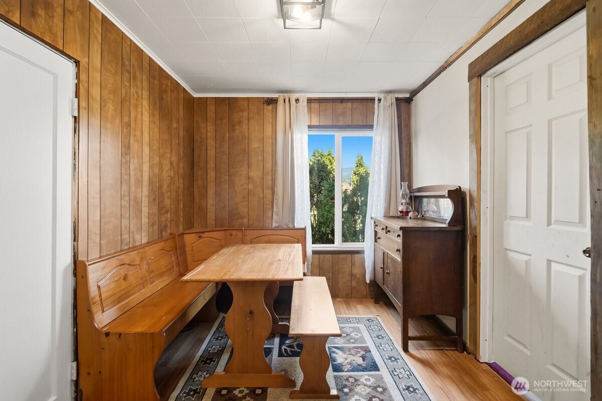 325 3rd Street Morton, WA 98356 - Photo 16 of 40 a view of hallway with furniture and a window