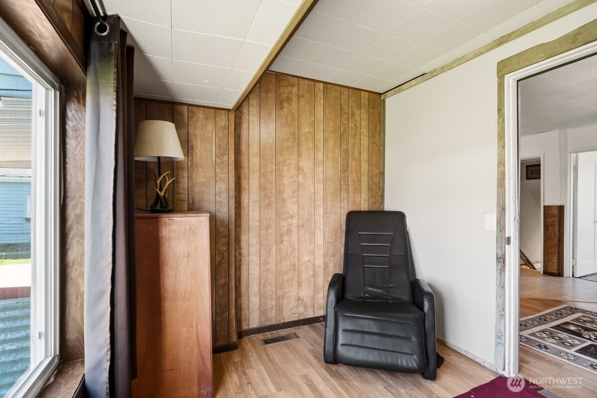 325 3rd Street Morton, WA 98356 - Photo 17 of 40 a view of a hallway with wooden floor and staircase