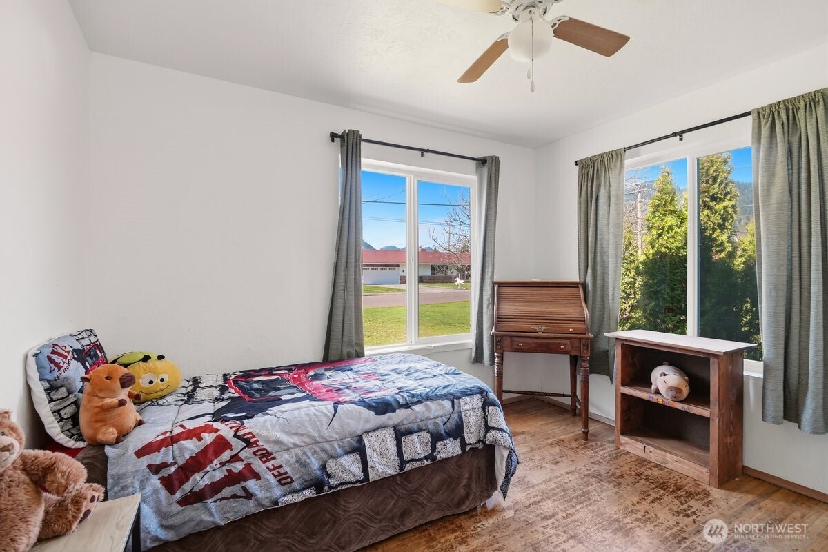 325 3rd Street Morton, WA 98356 - Photo 18 of 40 a bedroom with a bed and a window