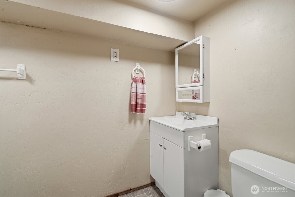 325 3rd Street Morton, WA 98356 - Photo 22 of 40 a bathroom with a sink toilet and mirror