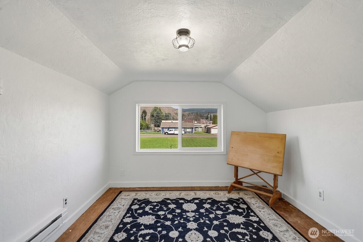 325 3rd Street Morton, WA 98356 - Photo 29 of 40 a room with window and a table