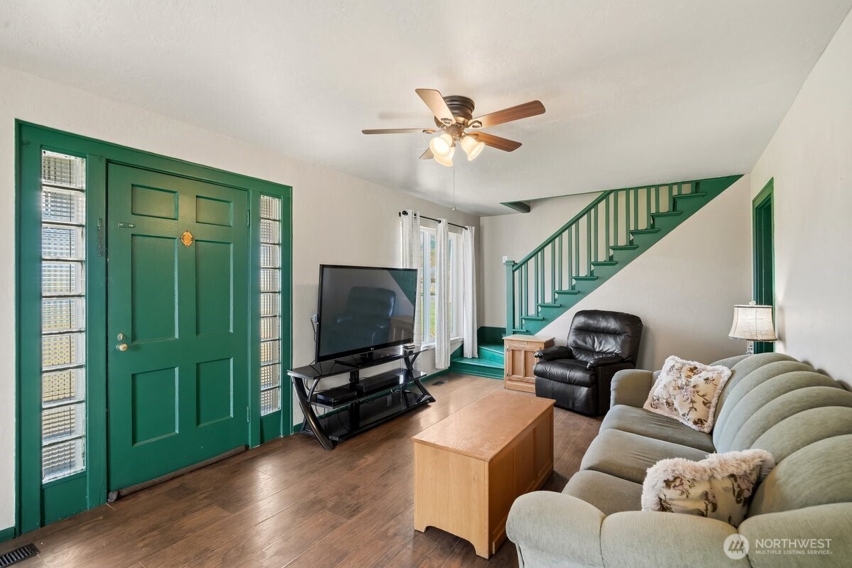 325 3rd Street Morton, WA 98356 - Photo 3 of 40 a living room with furniture and a flat screen tv