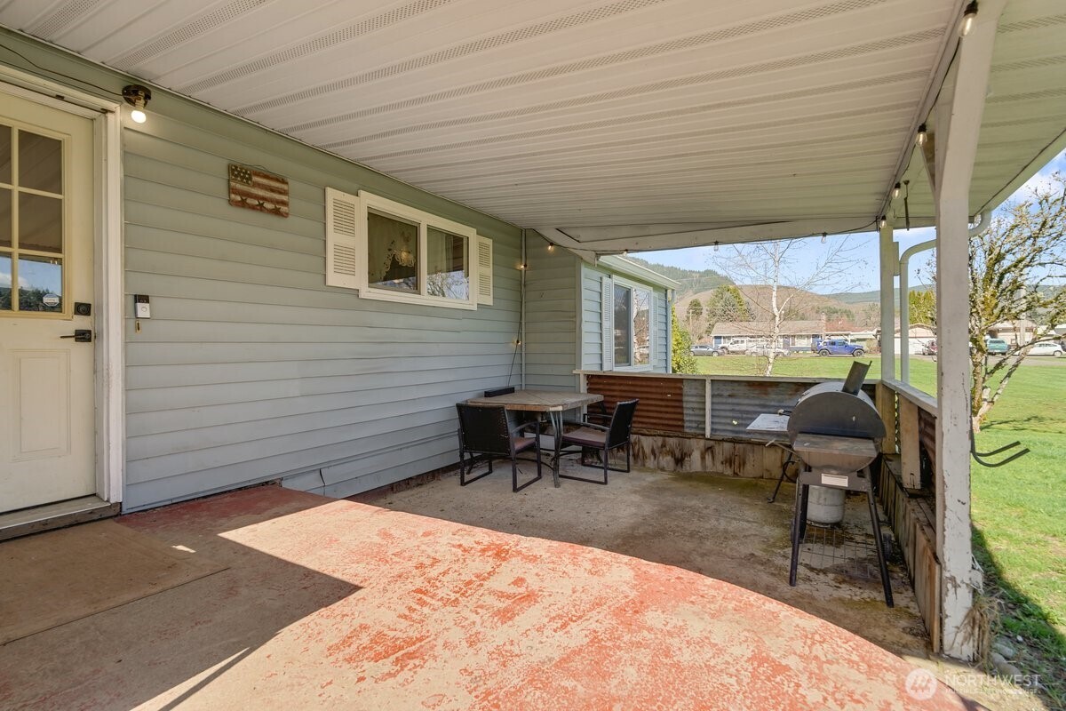 325 3rd Street Morton, WA 98356 - Photo 32 of 40 a backyard of a house with outdoor seating