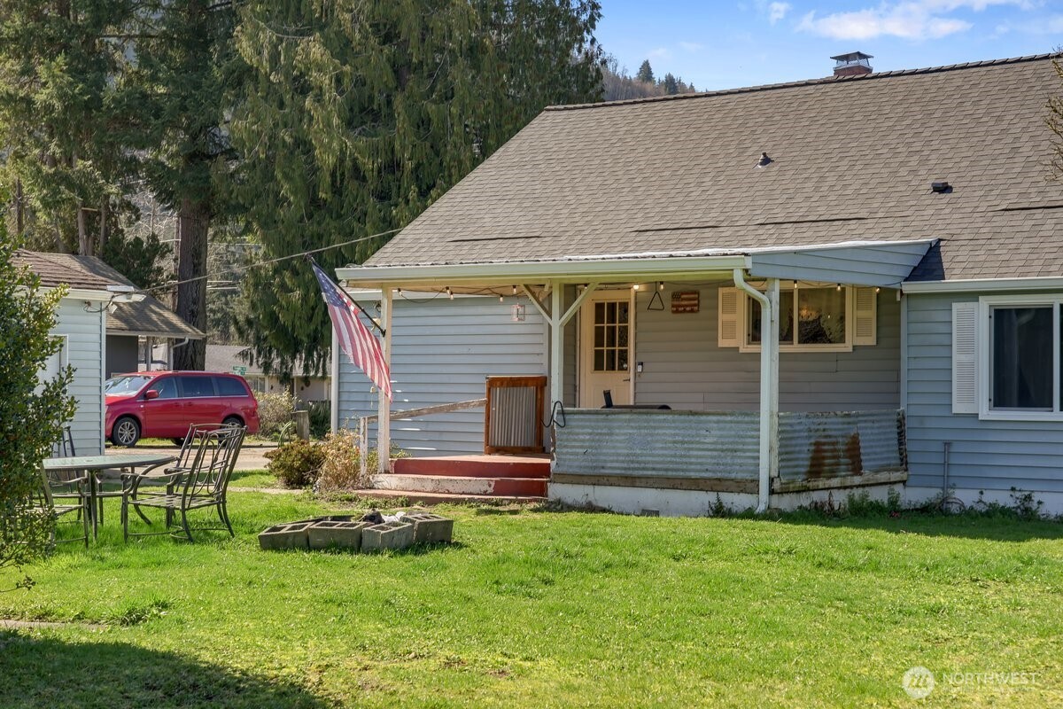 325 3rd Street Morton, WA 98356 - Photo 33 of 40 a backyard of a house with table and chairs