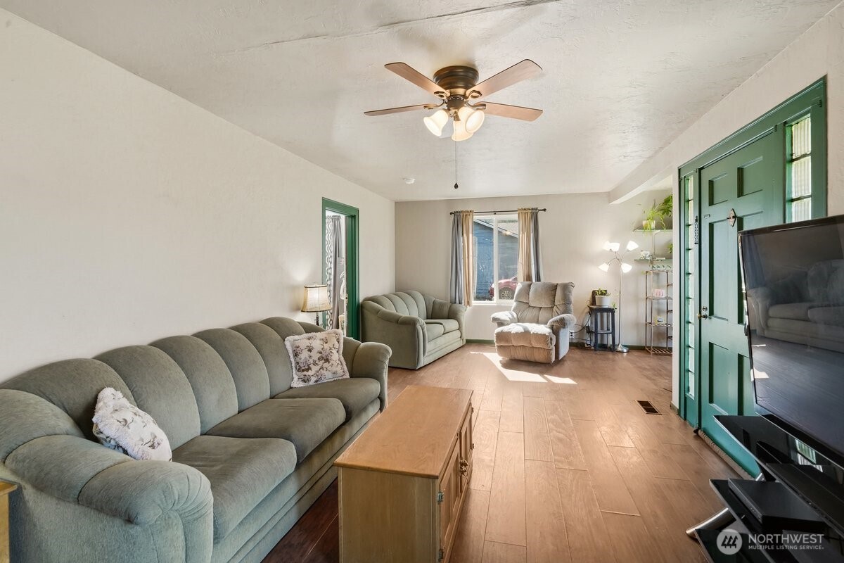 325 3rd Street Morton, WA 98356 - Photo 4 of 40 a living room with furniture and a flat screen tv