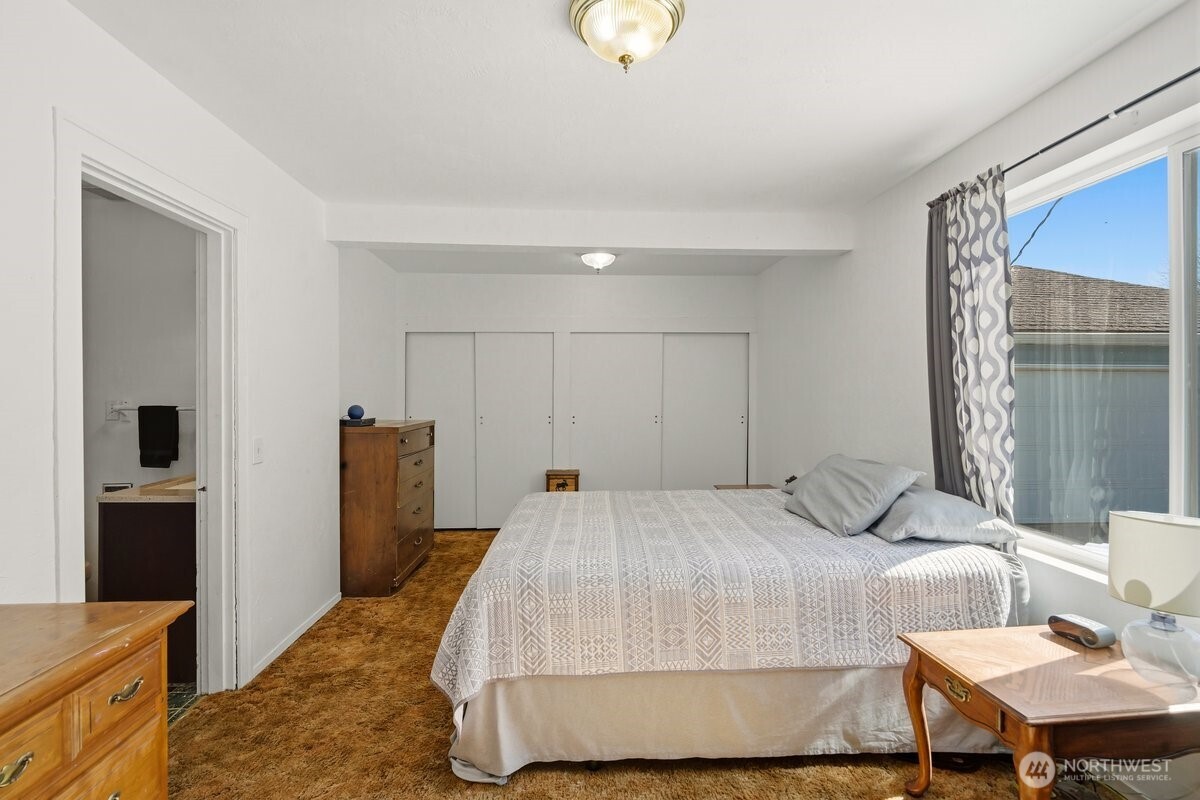 325 3rd Street Morton, WA 98356 - Photo 6 of 40 a bedroom with a bed and a table in it