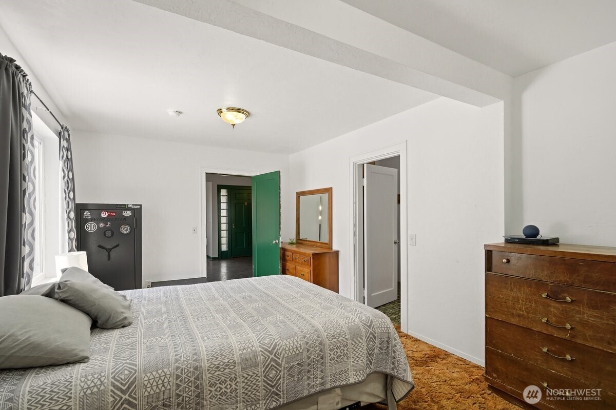 325 3rd Street Morton, WA 98356 - Photo 7 of 40 a bedroom with a bed and a dresser