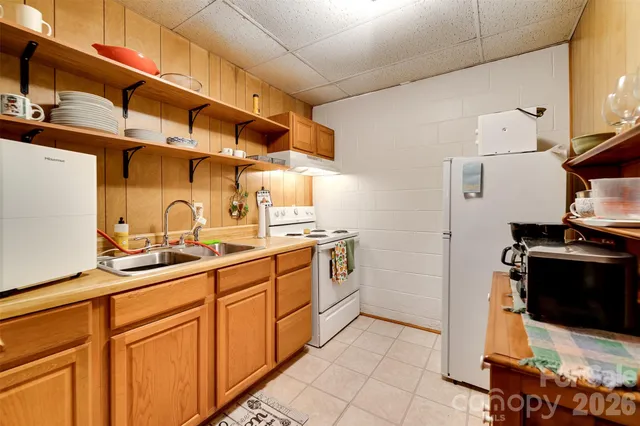 a kitchen with a sink and wooden cabinets