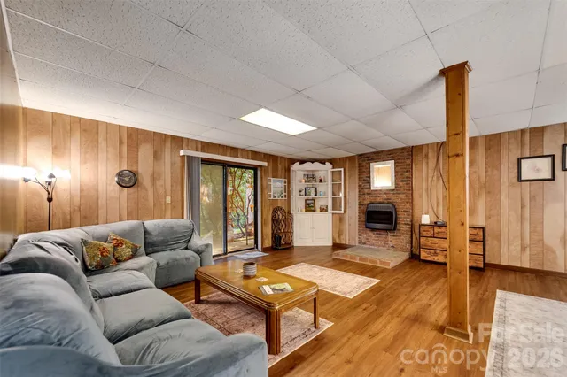 a living room with furniture and large window