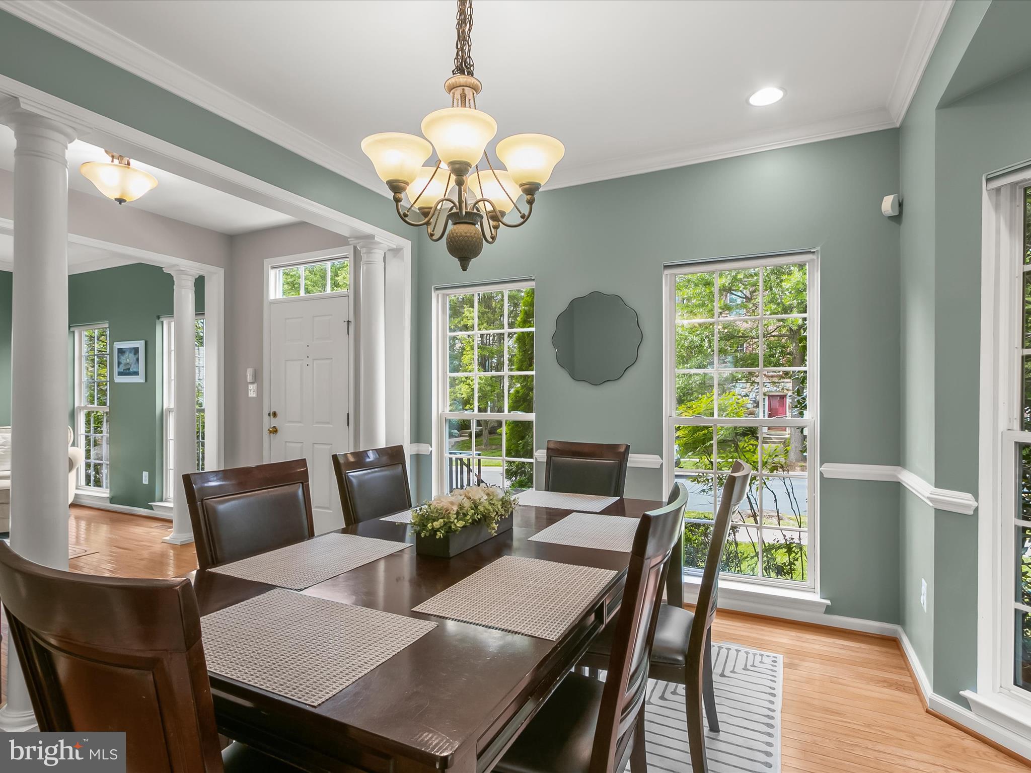 9808 Darcy Forest Drive Silver Spring, MD 20910 - Photo 14 of 82 a view of a dining room with furniture a chandelier and wooden floor