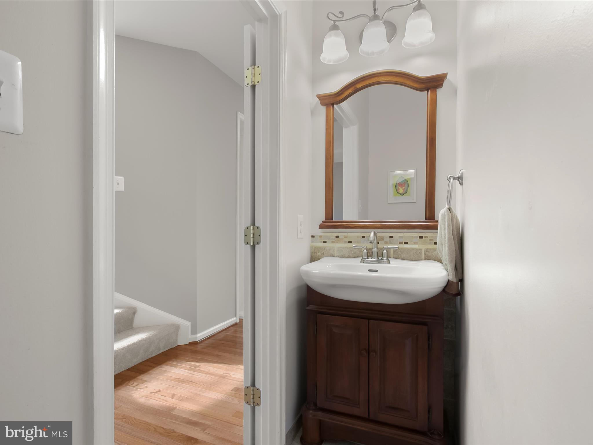 9808 Darcy Forest Drive Silver Spring, MD 20910 - Photo 16 of 82 a bathroom with a sink and a mirror
