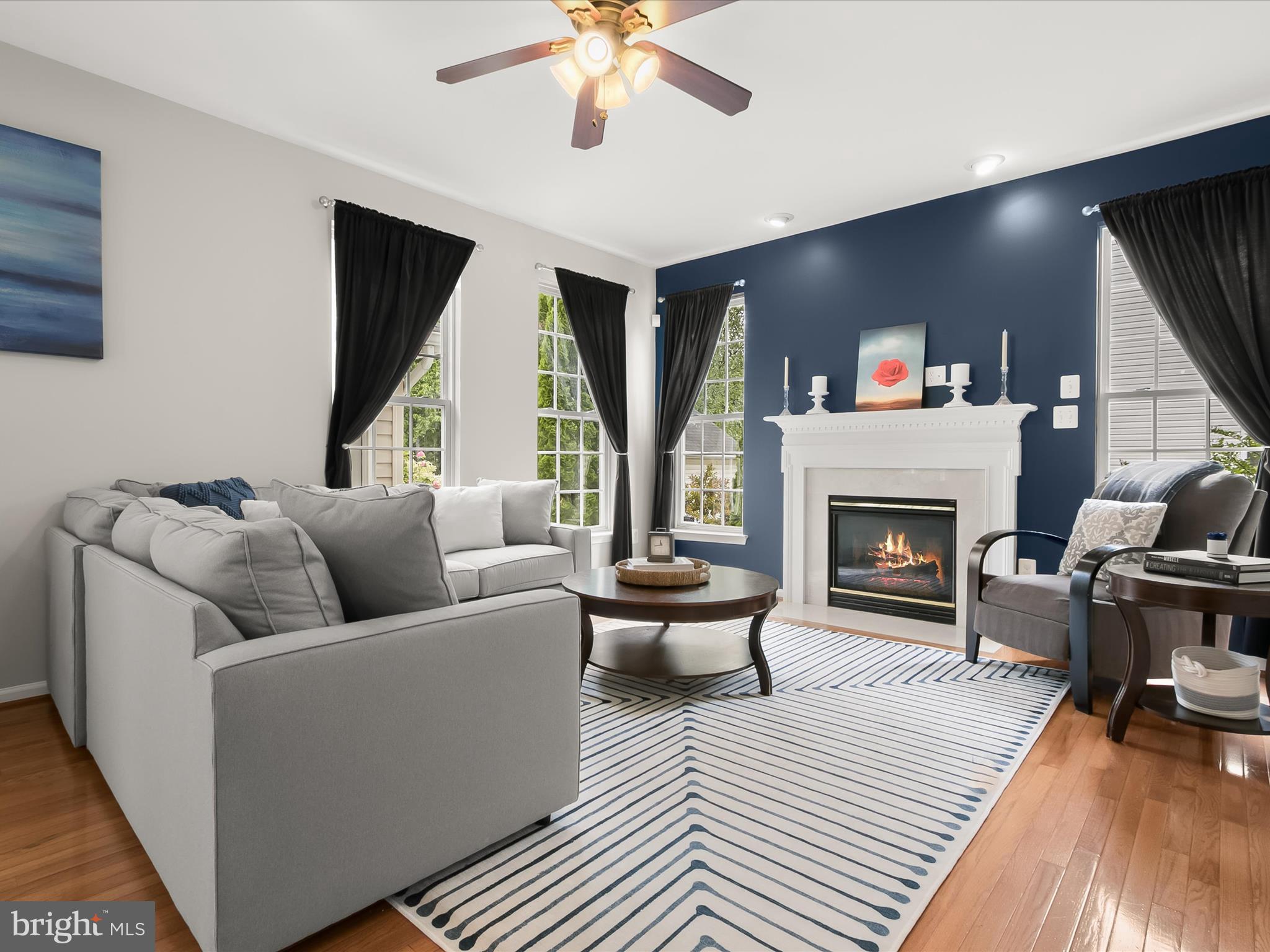 9808 Darcy Forest Drive Silver Spring, MD 20910 - Photo 17 of 82 a living room with furniture and a fireplace