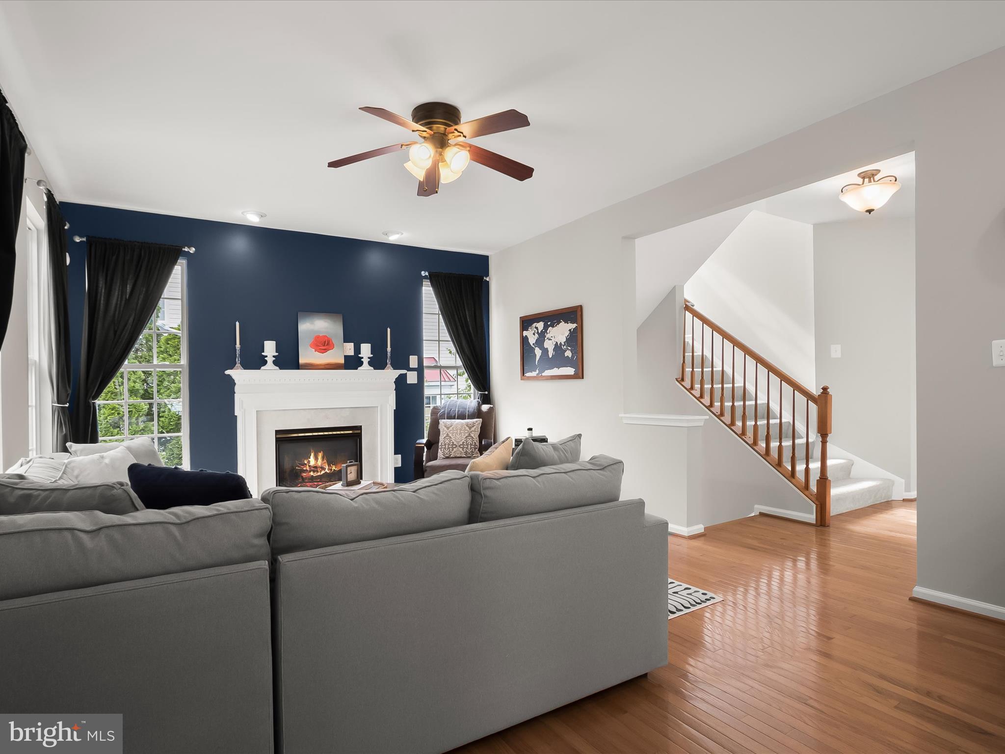 9808 Darcy Forest Drive Silver Spring, MD 20910 - Photo 18 of 82 a living room with furniture and a fireplace