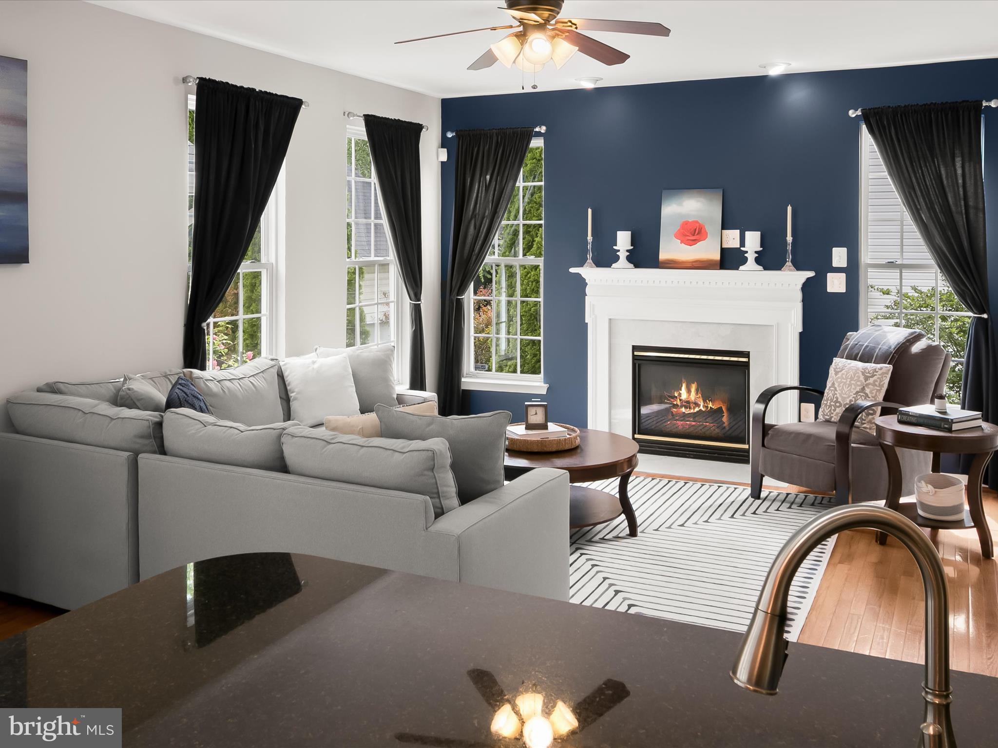 9808 Darcy Forest Drive Silver Spring, MD 20910 - Photo 19 of 82 a living room with furniture and a fireplace