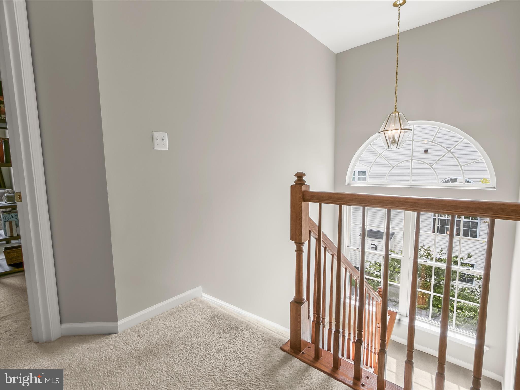 9808 Darcy Forest Drive Silver Spring, MD 20910 - Photo 27 of 82 a view of a hallway with a door and stairs