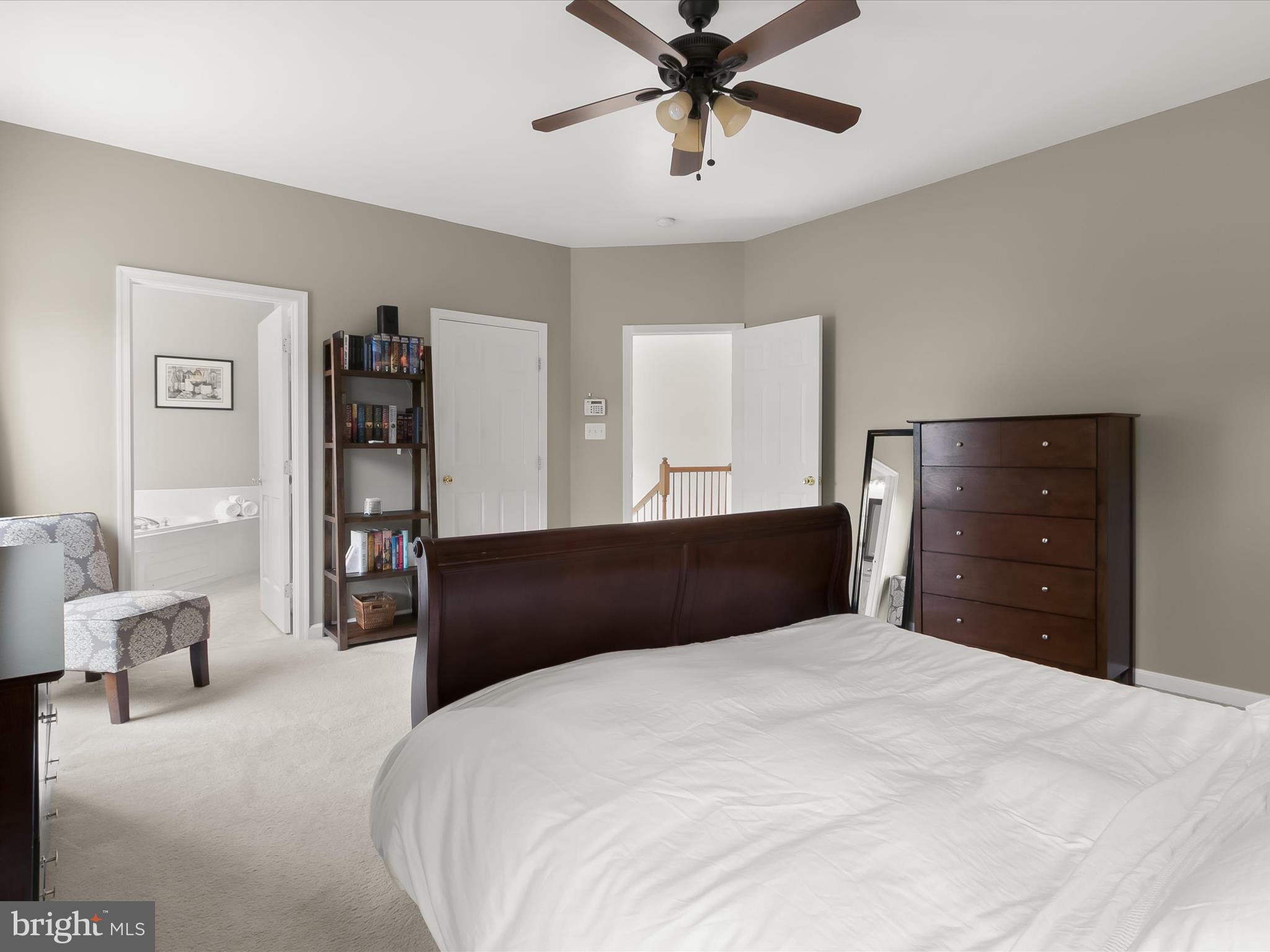 9808 Darcy Forest Drive Silver Spring, MD 20910 - Photo 30 of 82 a bedroom with a bed and a chandelier