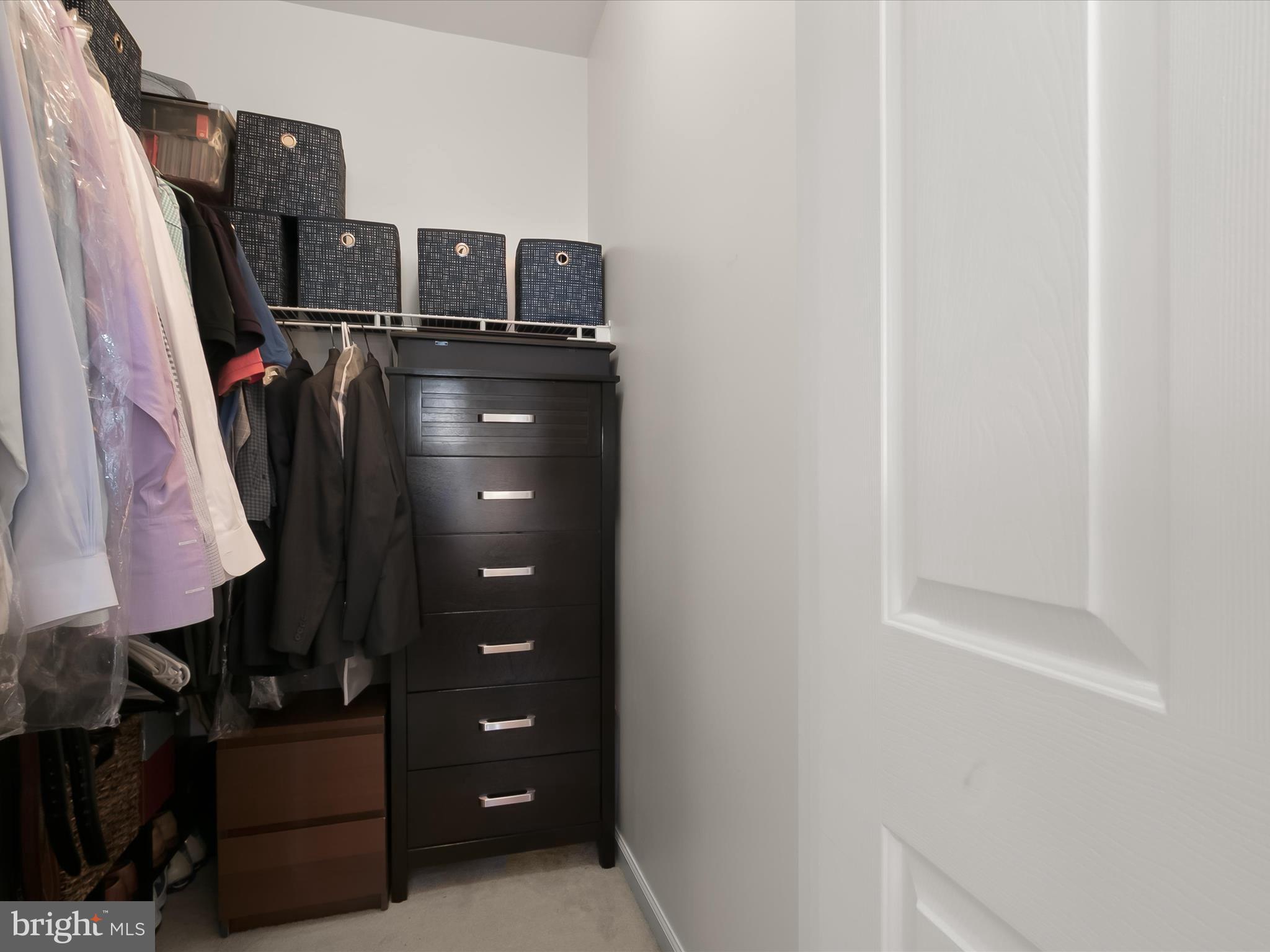 9808 Darcy Forest Drive Silver Spring, MD 20910 - Photo 32 of 82 a view of walk in closet with clothes and shoes