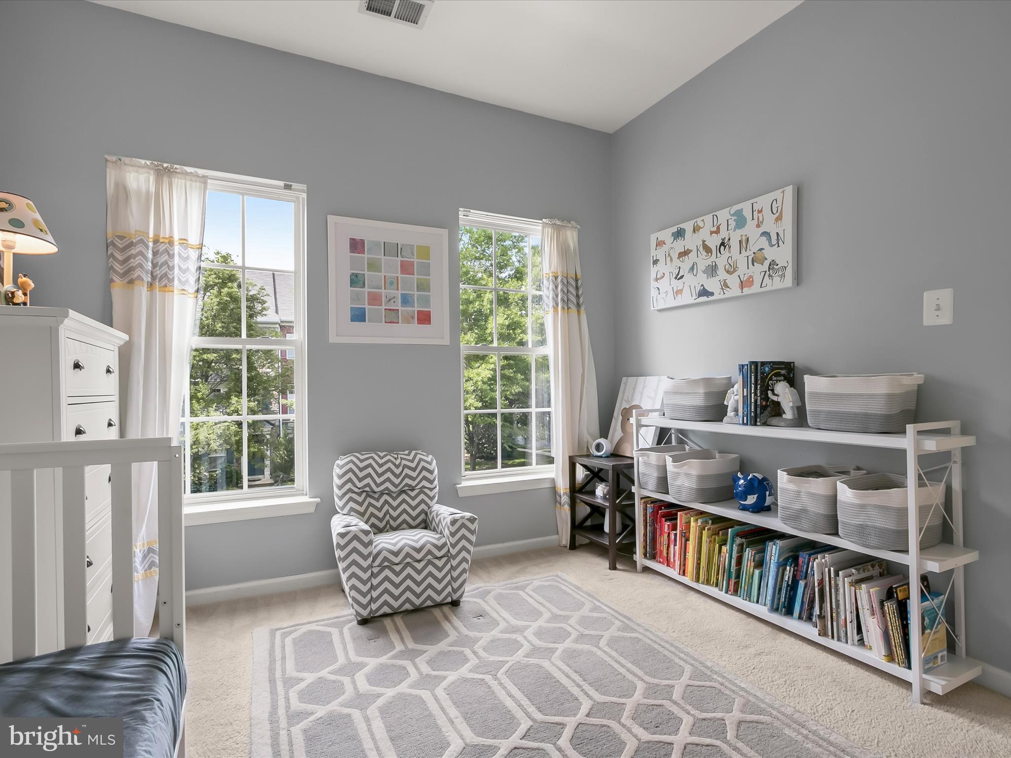 9808 Darcy Forest Drive Silver Spring, MD 20910 - Photo 41 of 82 a living room with lots of furniture and a book shelf