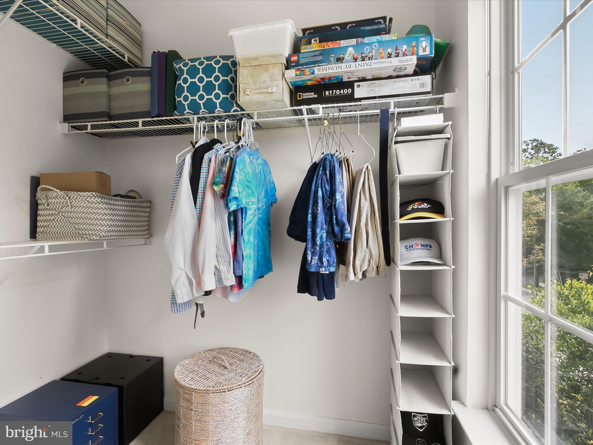 9808 Darcy Forest Drive Silver Spring, MD 20910 - Photo 48 of 82 a view of walk in closet with clothes and shoes